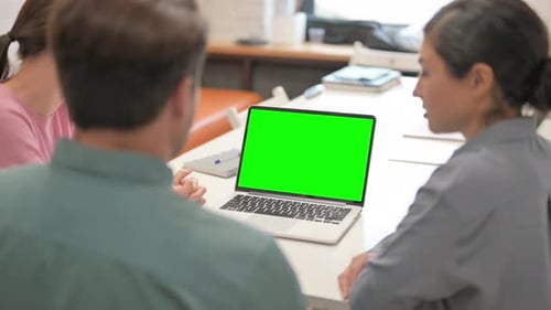 Multi Ethnic Team Using Laptop with Green Screen