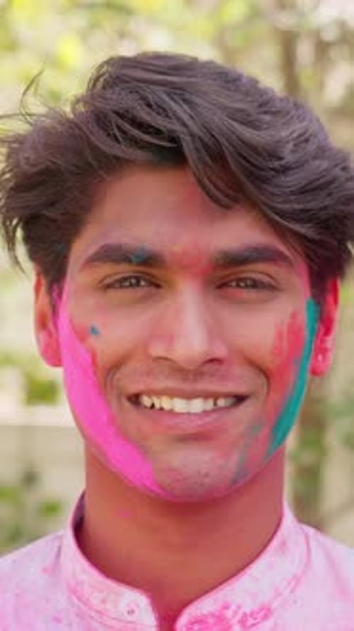 Man Smiling with Holi Powder on Face
