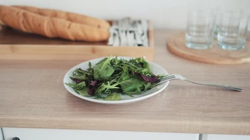Salad and Bread on Kitchen Counter