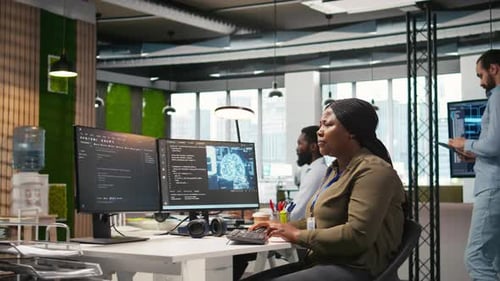 Female Software Developer Using Artificial Intelligence to Optimize Performance