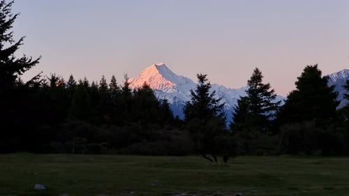 A sunset Timelapse of mount cook from Glentanner campground as the light fades the peak glows pink