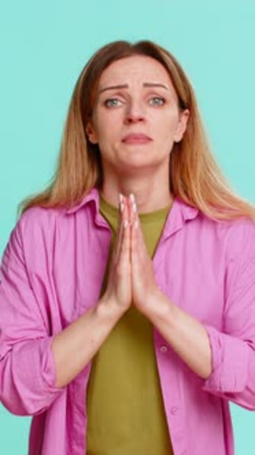 Woman Praying and Showing Distress in Portrait Video