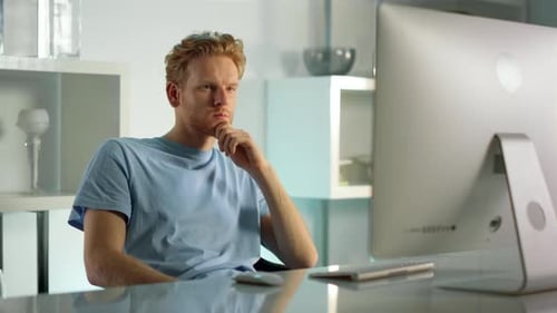 Man Works at Computer in Bright Modern Office