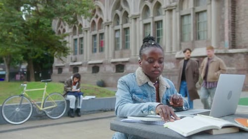 Black Girl Studying with Laptop Outdoors on College Campus
