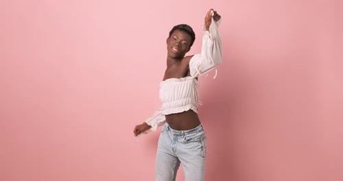 Stylish Young Adult Dances in a Fashionable Outfit