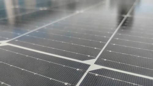 Solar panels are installed in the roof area of the building to harvest solar energy and turn it