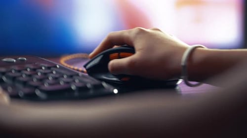 Hand Operating Gaming Mouse Near Keyboard