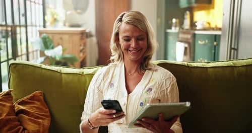 Woman Using Tablet and Smartphone on Couch