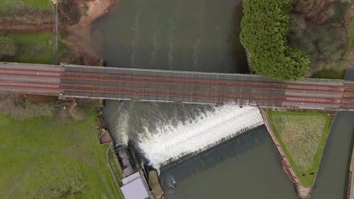 Aerial perspective of a fish pass and hydroelectric energy generation at a weir on the River Trent.