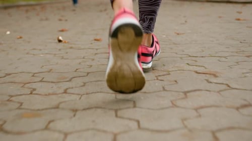 Close Up Female Legs Foots Feet Running in Park Outdoors Morning Sport Routine Sporty Lifestyle