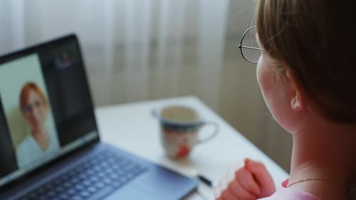 Girl Video Calling with Friends on Laptop