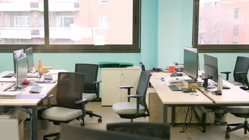 Empty Coworking Office with Computers Stationary and Chairs