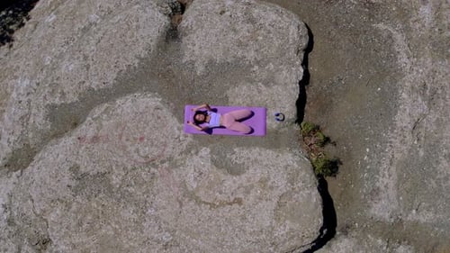 Yoga on Rocky Cliff Aerial Drone Shot