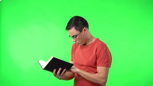 Man Reading Book on Green Screen