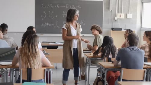 High School Teacher Conducting a Class with Diverse Teen Students