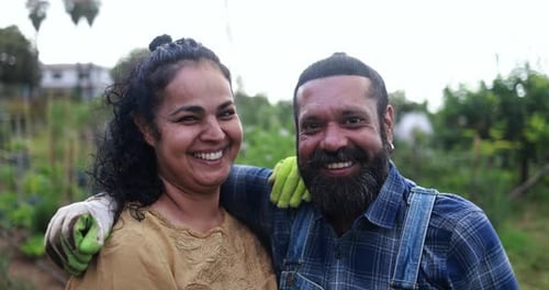 Indian Couple Smiling in Front of Camera From Garden Outdoor - Asian