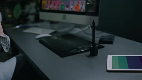 Woman Using Stylus and Tablet at Night