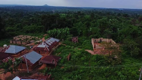 Beautiful establishing aerial of a remote village in the countryside of Nigeria, Africa
