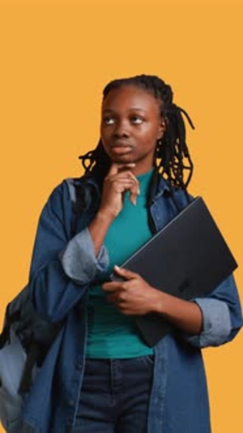 Vertical Video Pensive Woman Carrying Laptop Doing Thinking Gesture Studio Background
