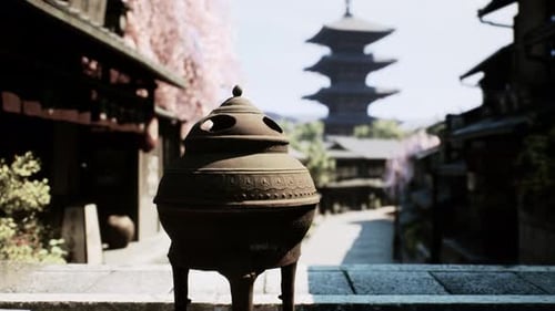 Traditional Japanese Pagoda and Incense Burner in Cherry Blossom Street