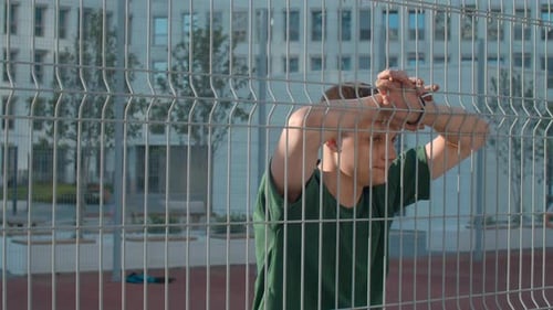 Young sportsman posing at basketball court