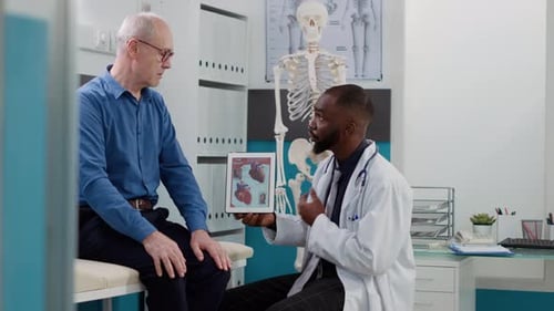 Doctor Explains Heart Condition to Senior Patient