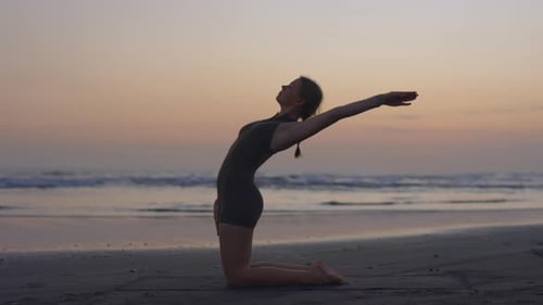 Yoga Enthusiast Outside Demonstrating Strength and Poise Outside Near the Sea
