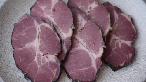 Meat, smoked ham, or pork sausage sliced for breakfast sandwiches. Sliced ham