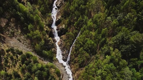 Aweinspiring Aerial View of Waterfall and Blooming Spring Landscape