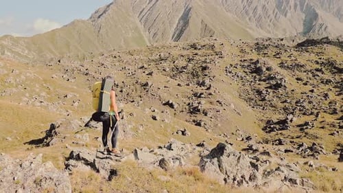Woman Hiker Enjoy Scenic Rocky Mountains Scenery (Panning)