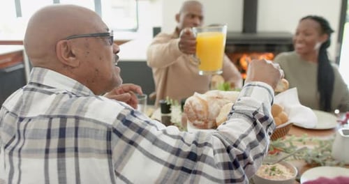 Diverse Group Sharing a Meal at Home
