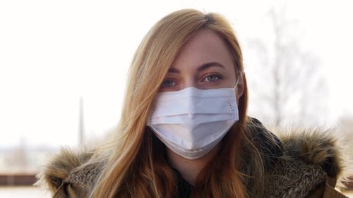 Health, Safety And Pandemic Concept - Young Woman Wearing Protective Medical Mask Outdoors