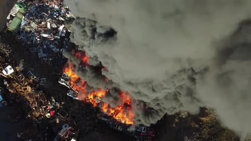 Huge Fire at Car Junkyard Black Oil Smoke Pollutes the Atmosphere Ecological Disaster Global Warming