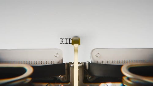 Old mechanical typewriter typing Kidnapping in a close-up view.