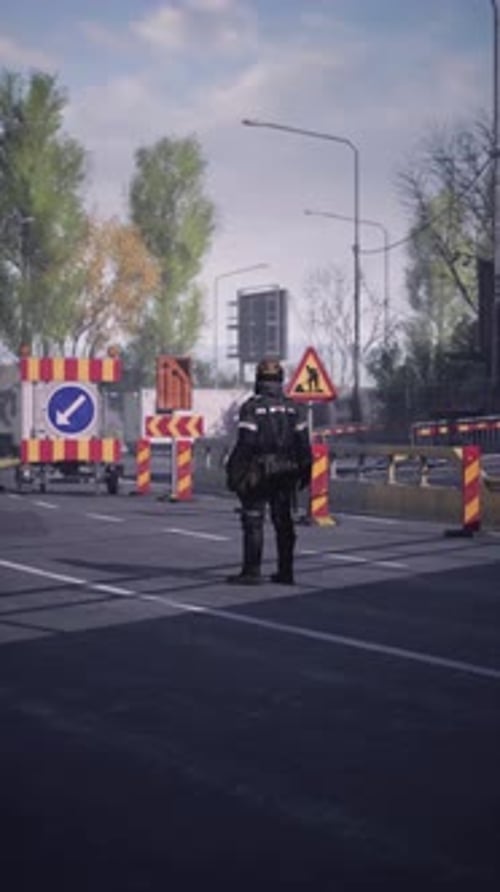 Road Worker Managing Traffic in a Busy City Area During Daytime