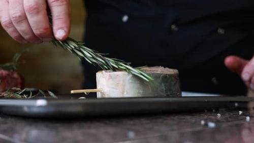 chef prepares a salmon dish in the kitchen. Close-up shots