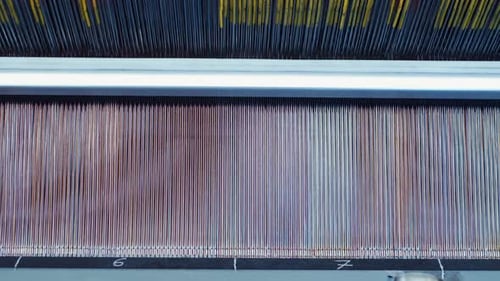 Carpet factory, carpet production, synthetic yarns for weaving loom. Electronic drive in rug weaving