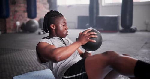 Black man, medicine ball and fitness for exercise, workout or training on floor at gym