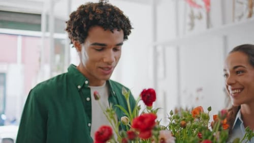 Satisfied Man Smell Flowers in Shop Happy African Guy Buy Bouquet in Store