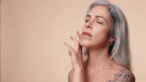 Senior Woman Touching Face