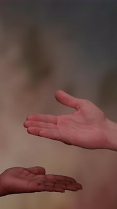 Hands Reaching Out to Each Other