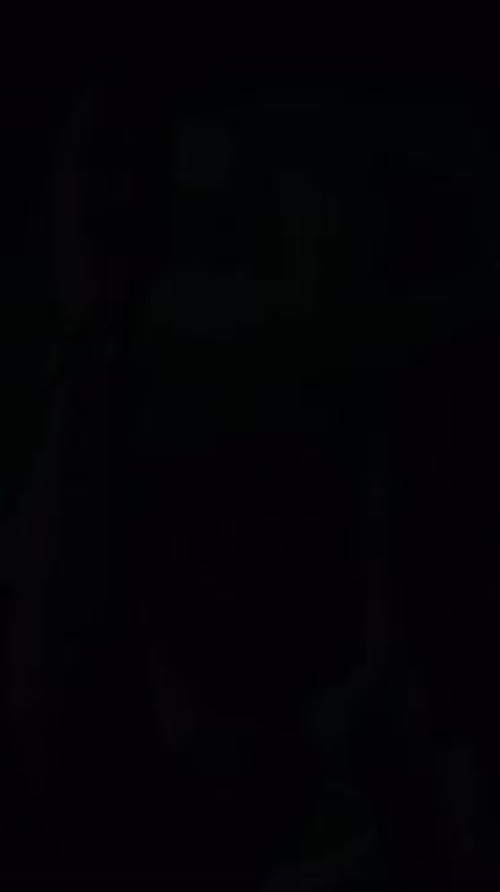 Abstract Close-Up of a Crowd Dancing in the Dark