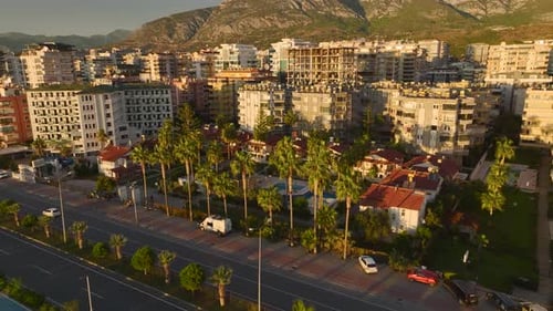 Aerial View Beachfront Villas with Vintage Charm Feature a Turquoise Pool and Lush Palms for a