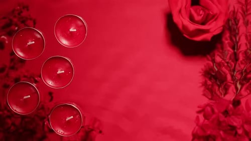 Composition of Flowers Candles on Pink Background with Water Waves Top View Closeup Wallpaper with