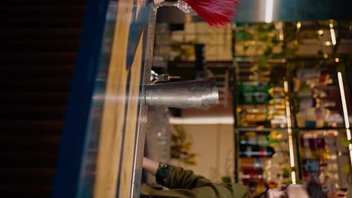 Bartender Preparing a Cocktail Behind Bar Counter