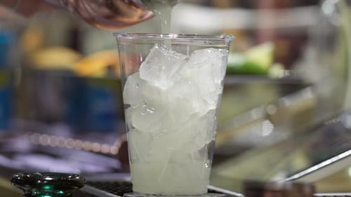 Detailed View of Caucasian Female Hand Holding a Cup of Cold Delicious Beverage