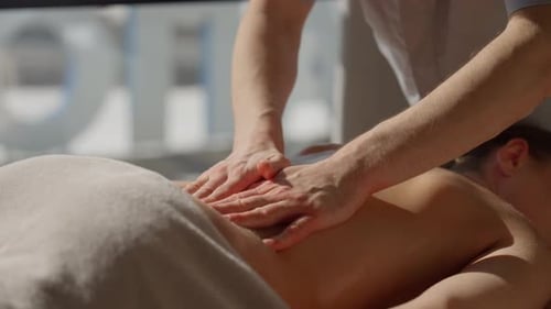 Relaxing Full Body Massage Therapy with Professional Masseur Hands Gently Massaging Woman Back and