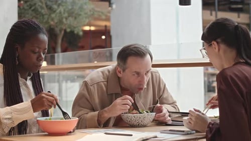 Colleagues on Lunch Break in Cafe