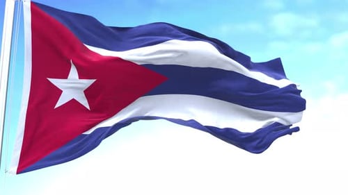 Cuban Flag Waving in the Wind Against Blue Sky