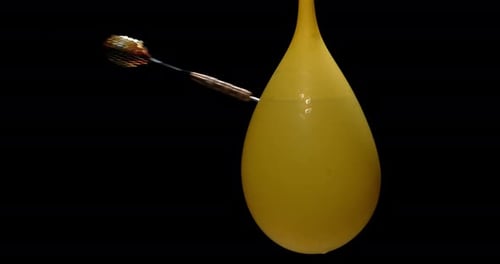 Water Balloon Explosion with Dart in Slow Motion